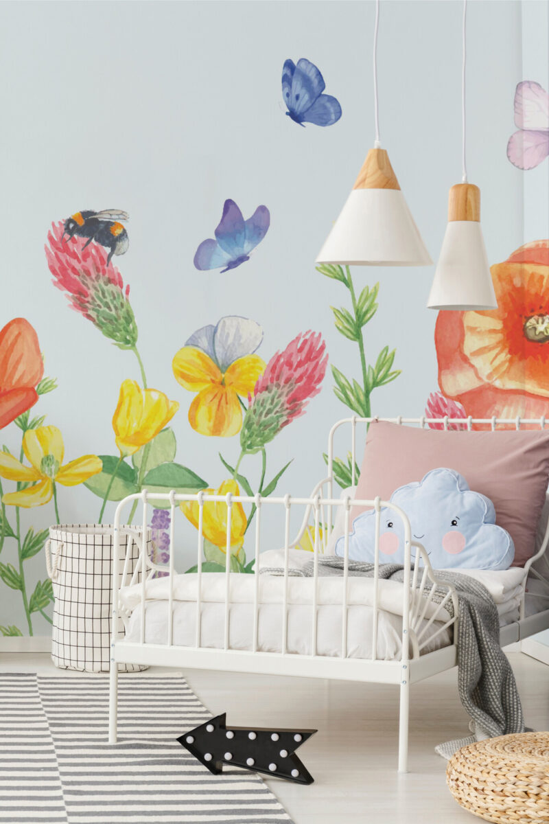 Watercolor Meadow Delight Wall Mural with bold colorful flowers, bees, and butterflies on a light blue background, ideal for bedrooms, reading corners, or dreamy interiors.