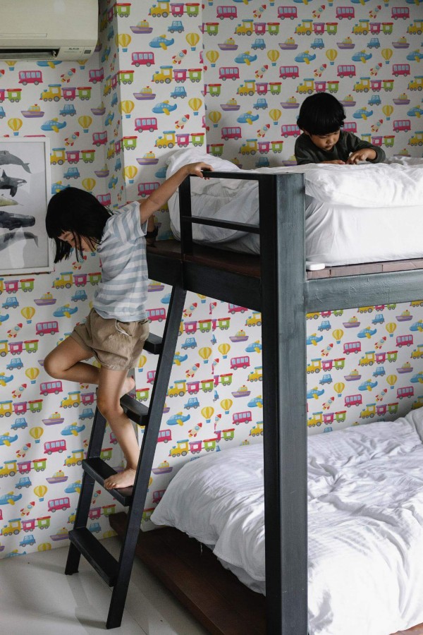 Minimalistic style kids room decorated with Cartoon toys peel and stick wallpaper