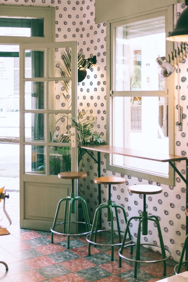 Fancy Walls traditional wallpaper featuring balanced black and white concentric dots.