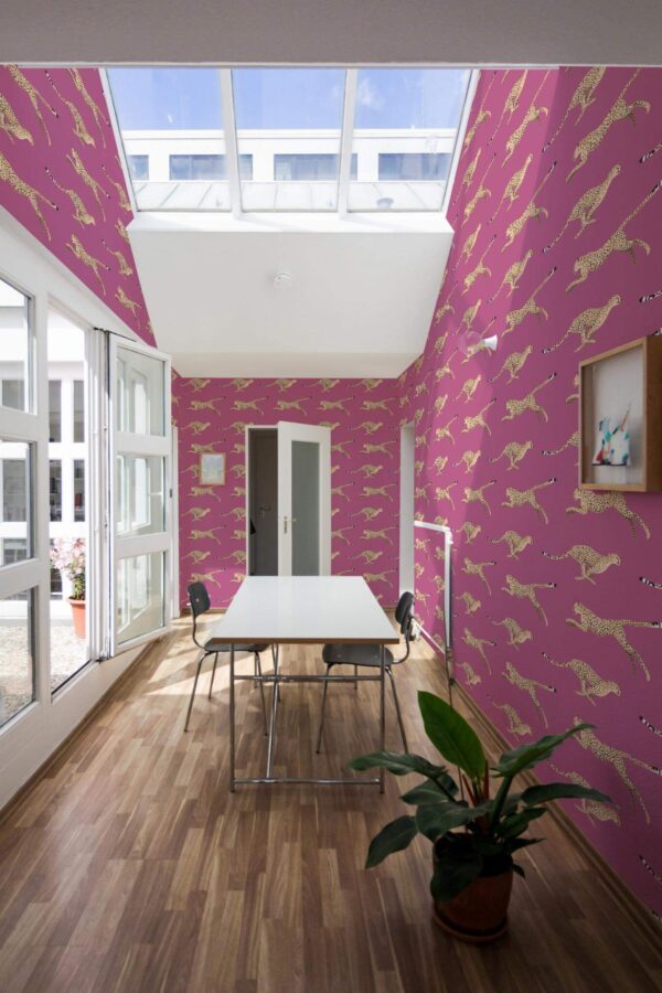 Minimal style dining room next to a balcony decorated with Cheetah peel and stick wallpaper