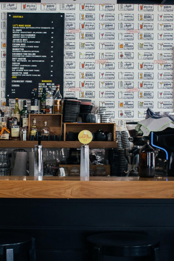 Industrial style bar decorated with Cocktail peel and stick wallpaper
