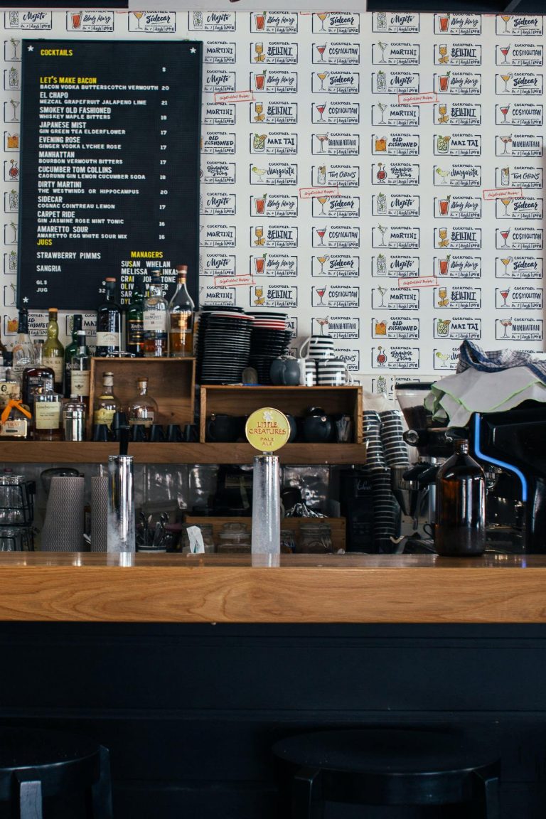 Industrial style bar decorated with Cocktail peel and stick wallpaper