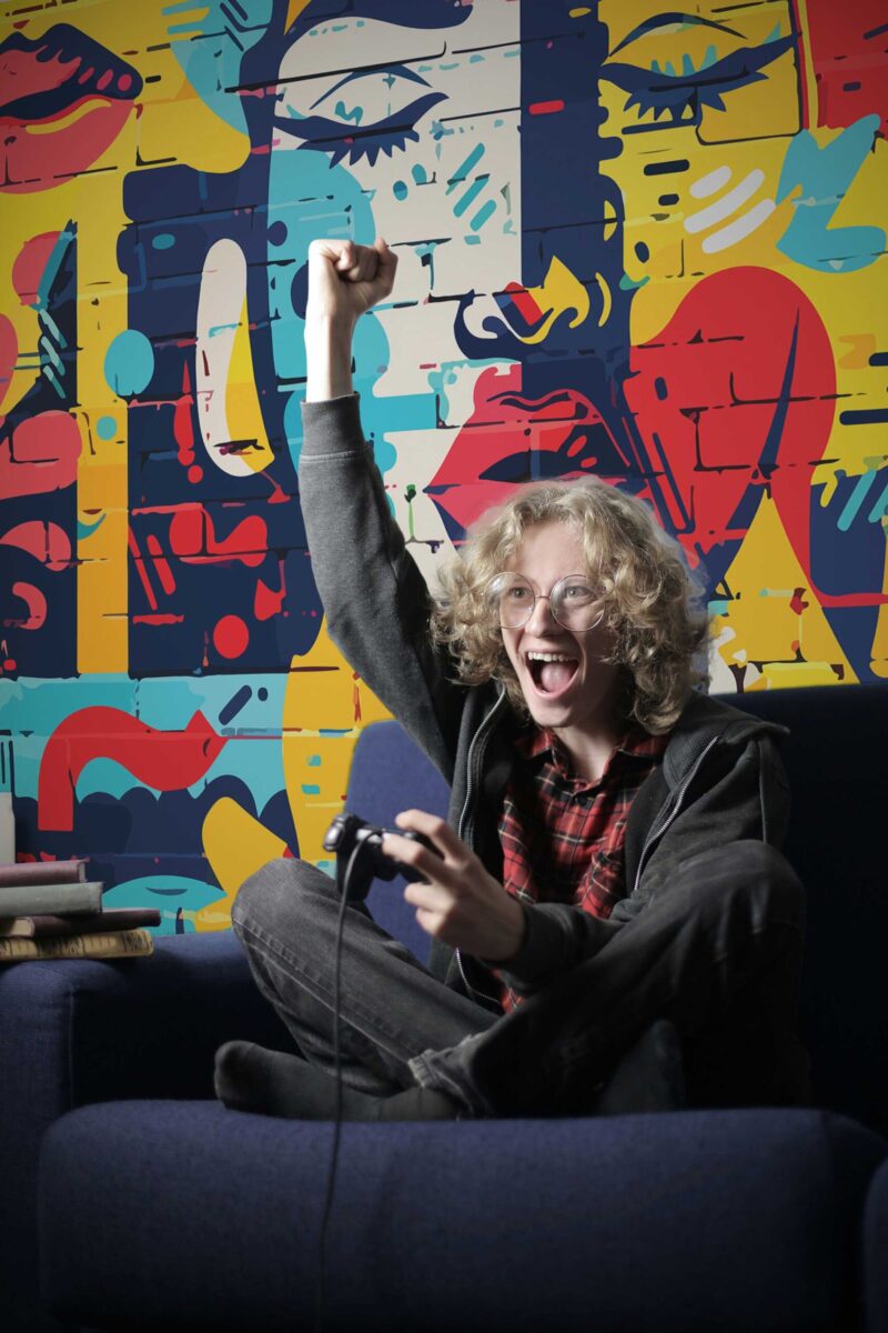 Brick Graffiti Wall Mural with colorful urban graffiti patterns over a brick texture, ideal for game rooms, accent walls, and modern interiors.