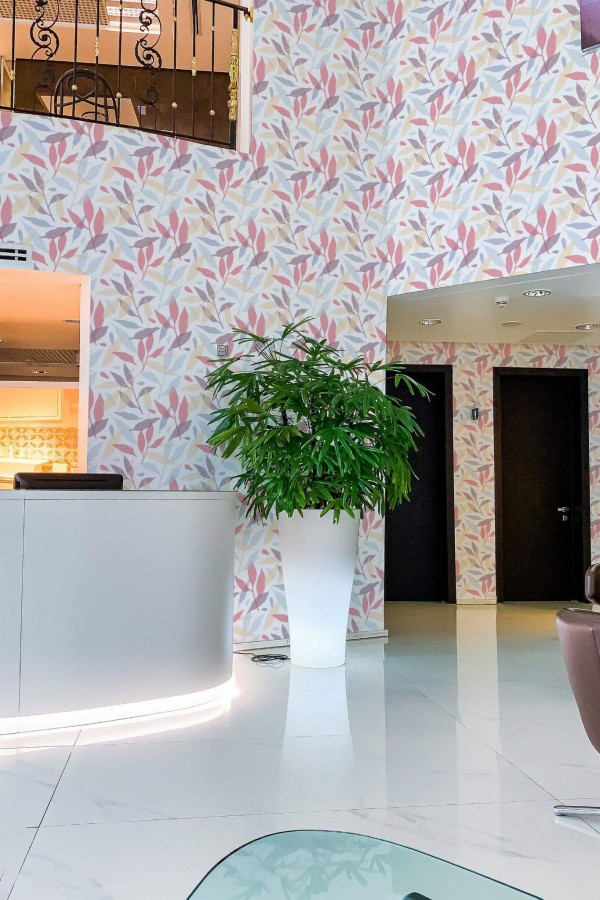 Modern style hallway in a hotel decorated with Colorful leaf peel and stick wallpaper