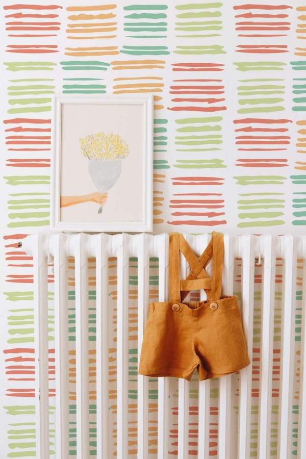 Bohemian style kids room decorated with Colorful Lines peel and stick wallpaper