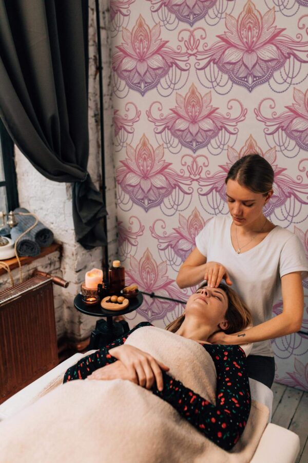 industrial style spa massage room decorated with Colorful lotus peel and stick wallpaper