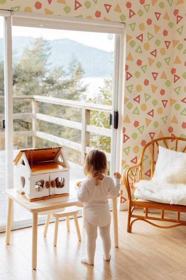 Boho gender neutral style kids room decorated with Colorful Shapes peel and stick wallpaper