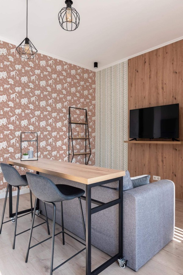 Scandinavian style open living room decorated with Copper boho animals peel and stick wallpaper