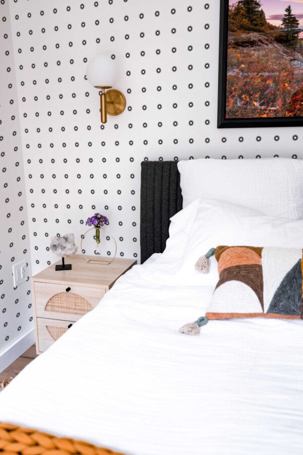 Fancy Walls traditional wallpaper featuring balanced black and white concentric dots.
