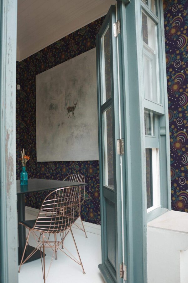 Minimal coastal style cafe decorated with Dark etheral cosmos peel and stick wallpaper