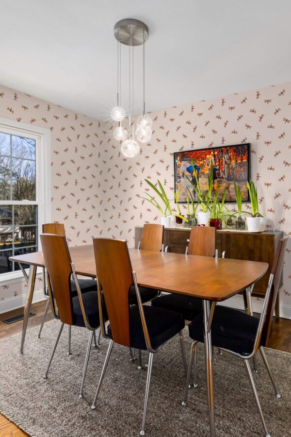 MId-century modern style dining room decorated with Dragonflies peel and stick wallpaper
