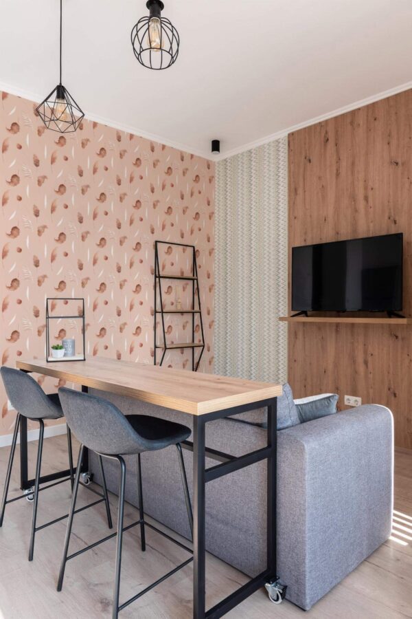 Scandinavian style open living room decorated with Dreamy boho leaf peel and stick wallpaper