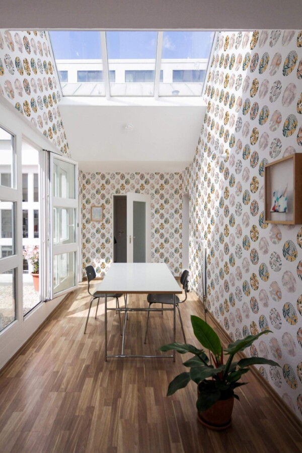 Minimal style dining room next to a balcony decorated with Easter Egg peel and stick wallpaper
