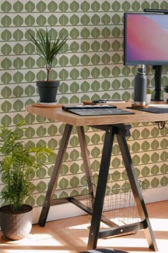 Scandinavian style home office decorated with Fall leaves peel and stick wallpaper