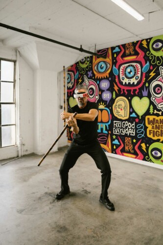 Cool Doodle Splash wall mural with colorful abstract doodle shapes on a black background, ideal for game rooms, playrooms, or creative accent walls.