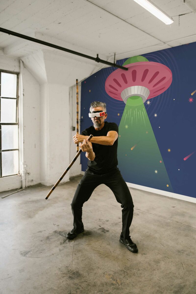 Retro UFO Adventure wall mural with blue and green fun starry UFO design, perfect for kids’ rooms, game rooms, or playful accent walls.