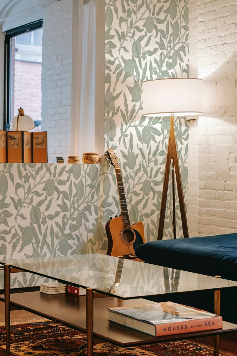 Sage Floral Elegance wall mural with soft green and white floral design, ideal for living rooms and botanical-inspired spaces.