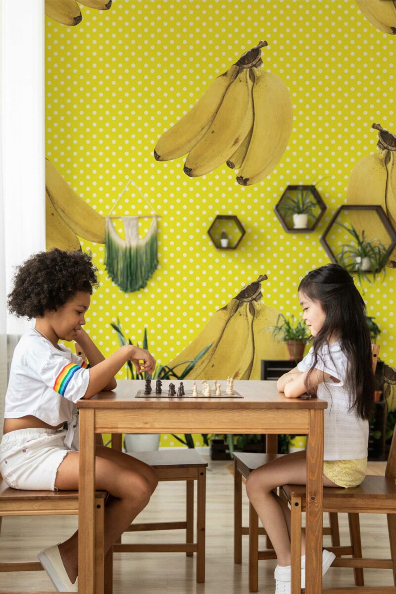 Sunny Banana Groove wall mural with quirky yellow banana pattern and dotted background, ideal for playful accent walls or kitchens.