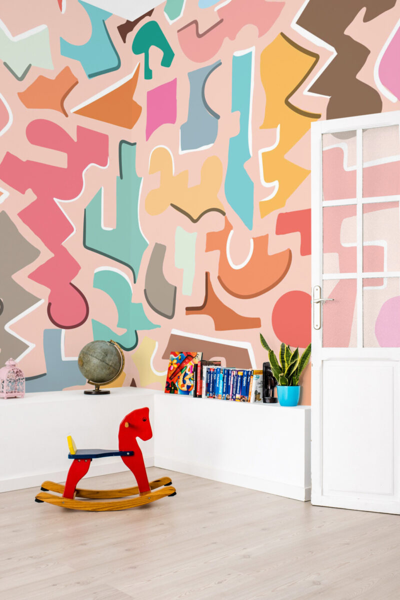 Colorful Doodle Fun Wall Mural with bold overlapping doodle shapes in lively colors on a peach background, ideal for kids’ rooms, playrooms, or creative learning spaces.