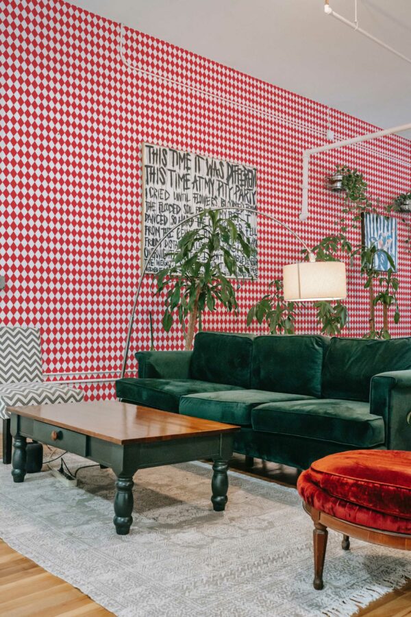Self-adhesive wallpaper featuring a red festive christmas pattern by Fancy Walls