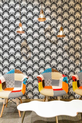 Traditional wallpaper with gothic damask-style lace by Fancy Walls. Vintage Gothic Laces wallpaper in cozy cafe interior
