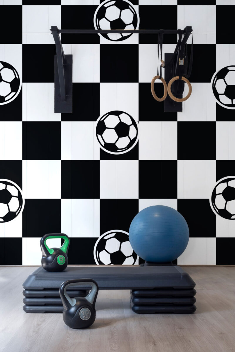 Football Checkered Wall Mural with repeating black-and-white footballs on a checkered pattern, ideal for gyms, game rooms, or sporty accent walls.