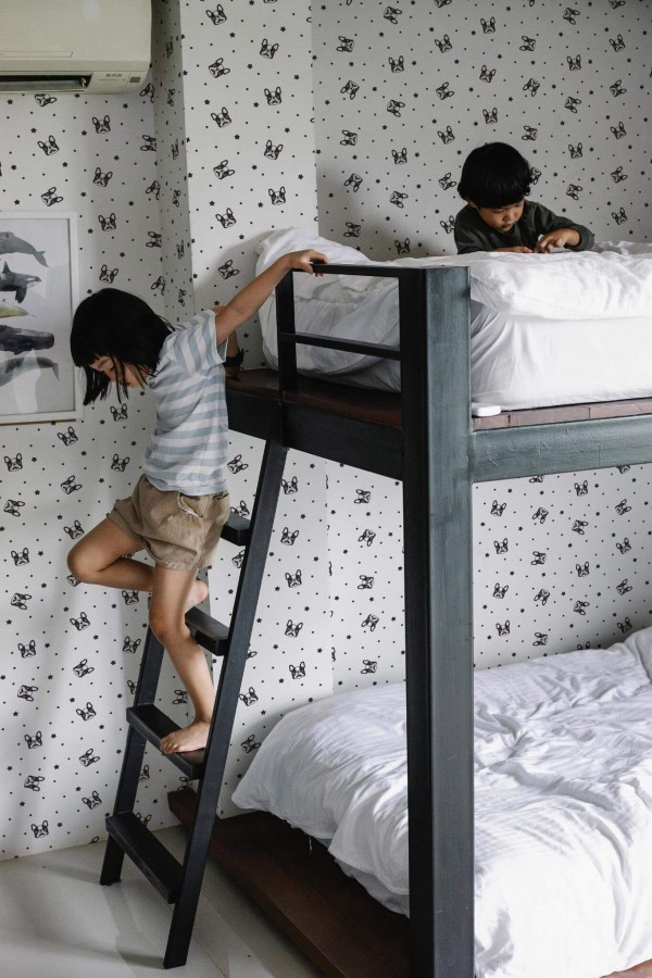 Minimalistic style kids room decorated with French bulldog peel and stick wallpaper