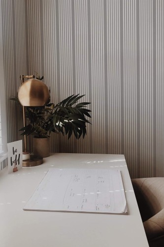 Rustic style home office decorated with French stripe peel and stick wallpaper
