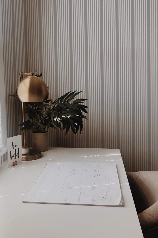 Rustic style home office decorated with French stripe peel and stick wallpaper