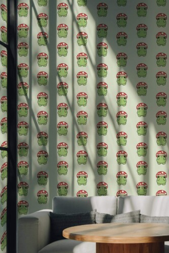 Fun frog peel and stick wallpaper with cartoon frogs in red mushroom hats on soft green background in cozy kids room nook