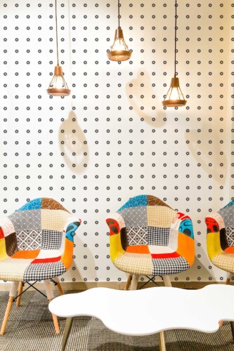 Fancy Walls self-adhesive wallpaper featuring modern geometric concentric dots.