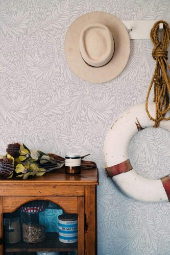 Coastal nautical style living room decorated with Gray palms peel and stick wallpaper