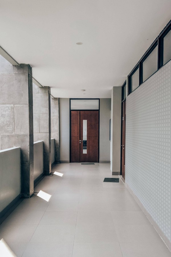 Industrial style hallway with a balcony decorated with Gray retro geometric peel and stick wallpaper