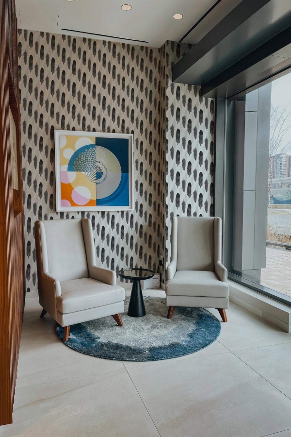 Mid-century-modern style living room decorated with Gray watercolor feather peel and stick wallpaper