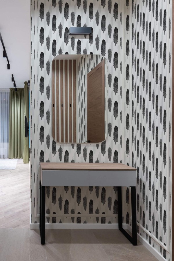 Modern scandinavian style entryway decorated with Gray watercolor feather peel and stick wallpaper
