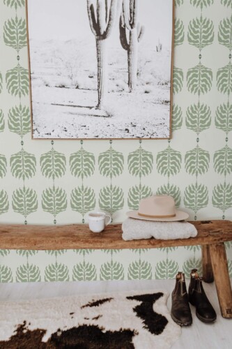 Scandinavian style entryway decorated with Green boho leaf peel and stick wallpaper