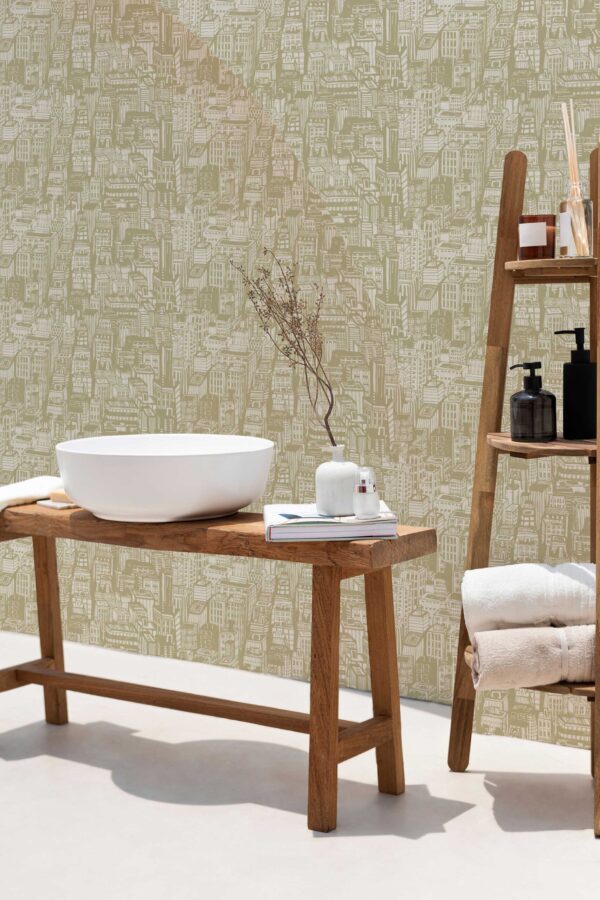 A modern powder room setup with light wood accents and Town Bakery green wallpaper. The wallpaper’s fun green cityscape pattern contrasts softly with white ceramics and natural textures, creating a cozy and inviting bathroom or spa-like space. This interior blends minimalist and rustic elements with a hint of urban charm.