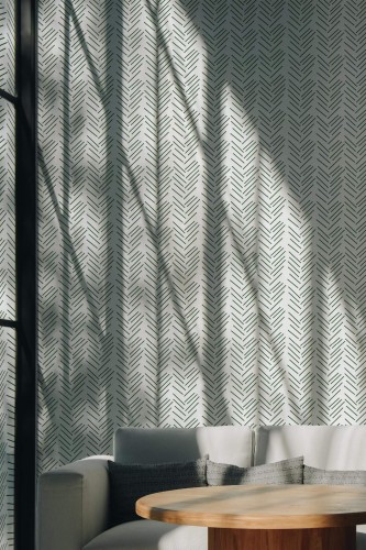 Scandinavian style living room decorated with Green herringbone peel and stick wallpaper