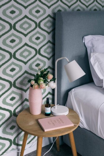 Rustic style bedroom decorated with Green ikat peel and stick wallpaper