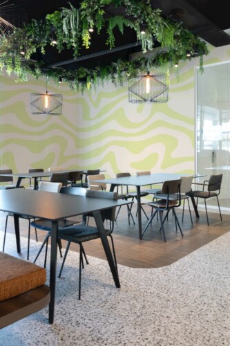 Neutral Groove Serene wall mural with green and cream abstract groovy pattern, perfect for living rooms, accent walls, or serene interiors.
