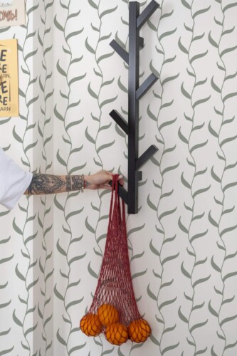 Scandinavian style kitchen decorated with Green vines peel and stick wallpaper