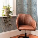 Mid-century modern style living room decorated with Hamsa hand peel and stick wallpaper