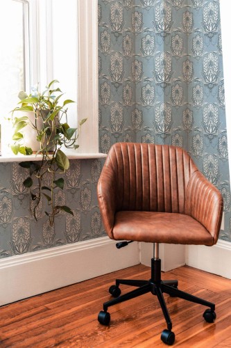 Mid-century modern style living room decorated with Hamsa hand peel and stick wallpaper