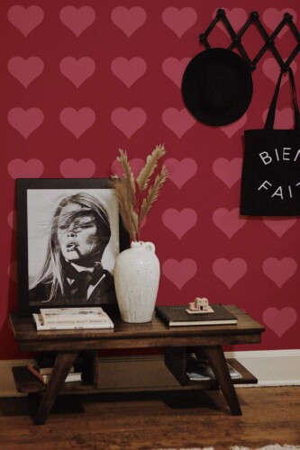 Rustic farmhouse style entryway decorated with Heart peel and stick wallpaper