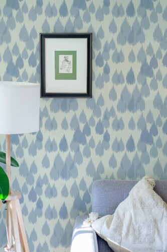 Eastern European style living room decorated with Ikat raindrop peel and stick wallpaper