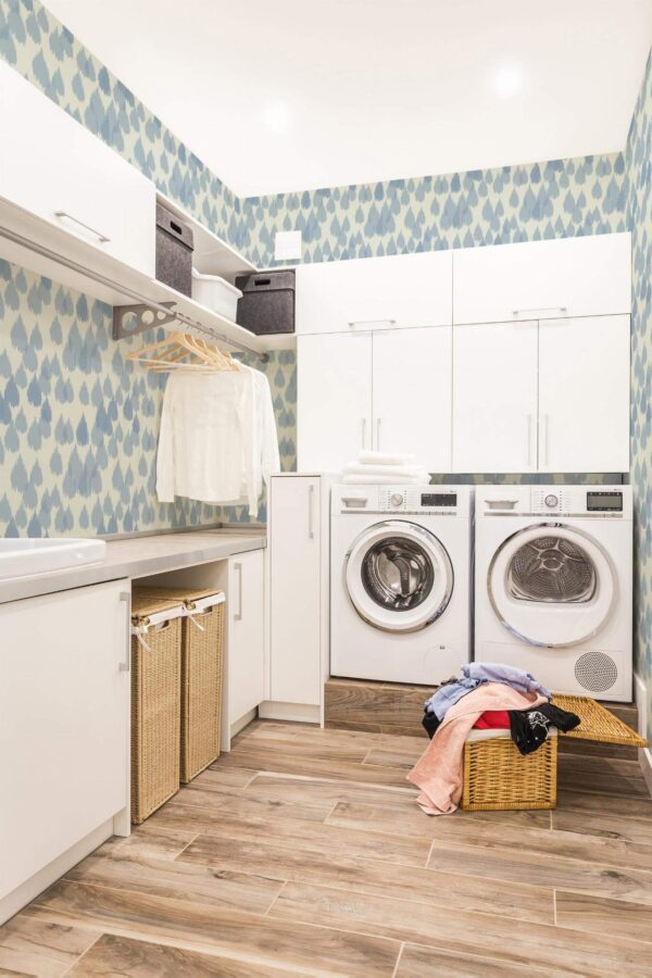 Scandinavian style laundry room decorated with Ikat raindrop peel and stick wallpaper