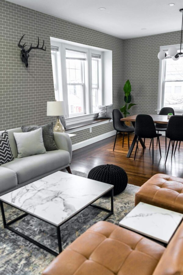 Mid-century modern scandinavian style living dining room decorated with Industrial Brick peel and stick wallpaper