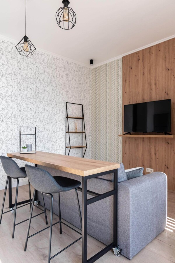 Scandinavian style open living room decorated with Lined lady body peel and stick wallpaper