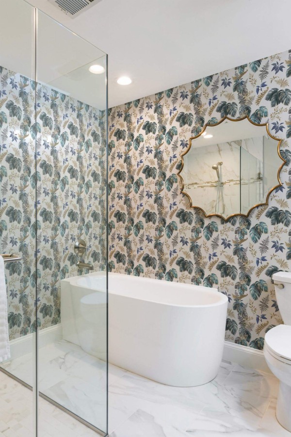Minimal modern style bathroom decorated with Lush tropical leaf peel and stick wallpaper
