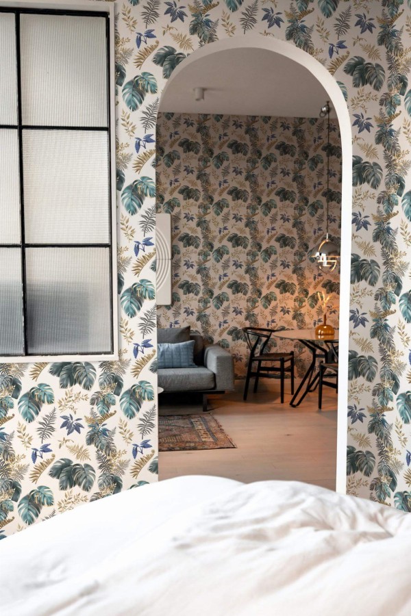 Modern scandinavian style living room decorated with Lush tropical leaf peel and stick wallpaper